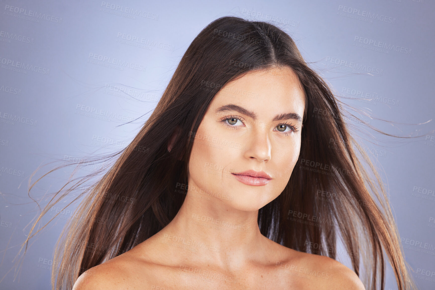 Buy stock photo Woman, beauty and hair for studio portrait with wind, growth and healthy shine on blue background. Aesthetic female model face for skincare, self care and haircare cosmetics for salon or hairdresser