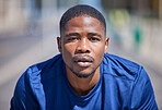 Fitness, portrait and black man in a city for running, focus and mindset on blurred background. Serious, face and male runner with sports routine preparation for cardio, exercise or intense workout