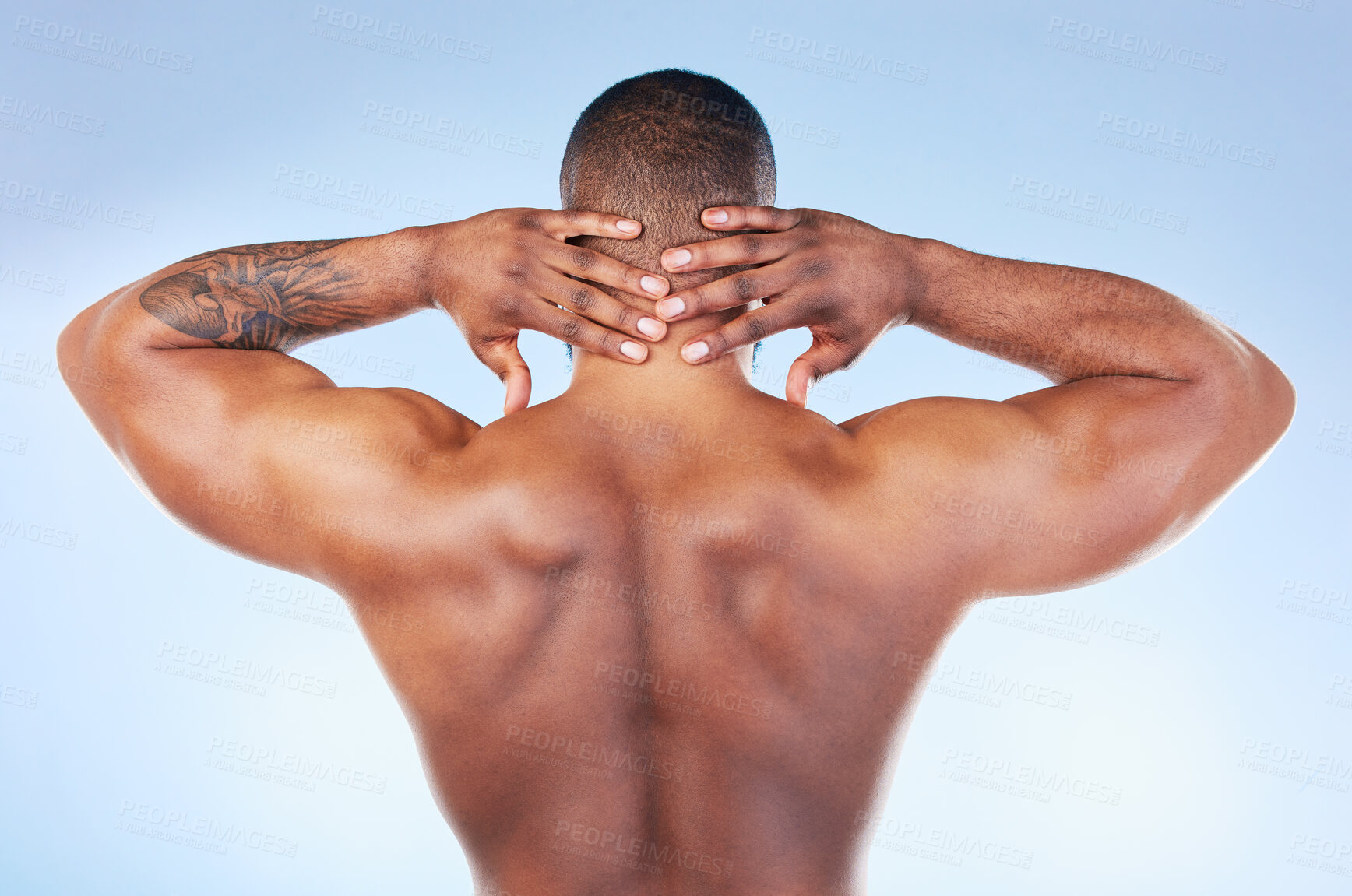 Buy stock photo Back, muscle and black man touching neck or head as self love, skincare and isolated in a studio blue background. Health, wellness and strong muscular bodybuilder or model embracing skin