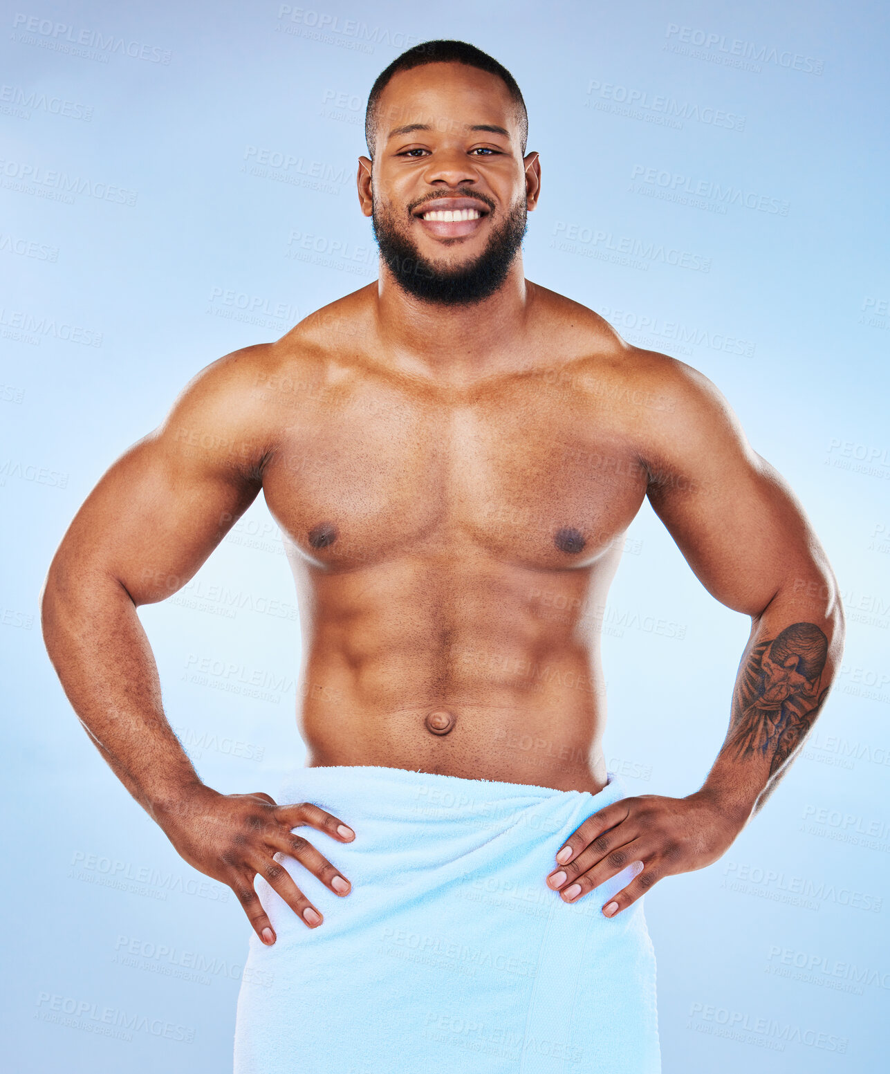 Buy stock photo Man body muscle, towel and portrait of a male smile with happiness from bodybuilder exercise. Cleaning, skincare and wellness after workout and fitness with isolated, studio and blue background