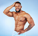 Towel, shower and fitness portrait of a black man with happiness from bodybuilder muscle. Cleaning, skincare and wellness after workout and exercise with isolated, studio and blue background