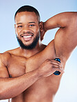 Deodorant, products and portrait of black man for beauty, grooming and body hygiene on blue background. Skincare, health and male spraying aerosol, fragrance and scent product for underarm wellness