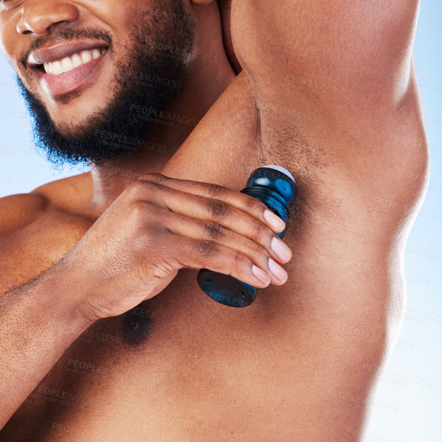 Buy stock photo Deodorant, armpit and black man with products for beauty, grooming and body hygiene on blue background. Skincare, wellness and male with antiperspirant, fragrance and scent product for fresh underarm