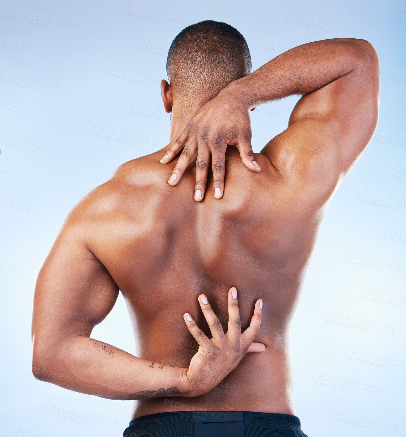 Buy stock photo Back, strong and black man with muscle touching his spine as self love, skincare and isolated in a studio blue background. Health, wellness and strong muscular male model embracing skin