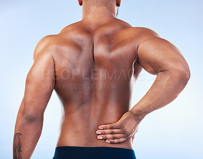 Buy stock photo Black man, back pain and injury with fitness and health, medical problem and aching body in studio. Emergency, muscle tension and male athlete with joint ache from workout on blue background