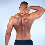 Black man, neck pain and injury with exercise and health, medical problem and aching body with back view. Emergency, muscle tension and male athlete with joint ache from workout on blue background