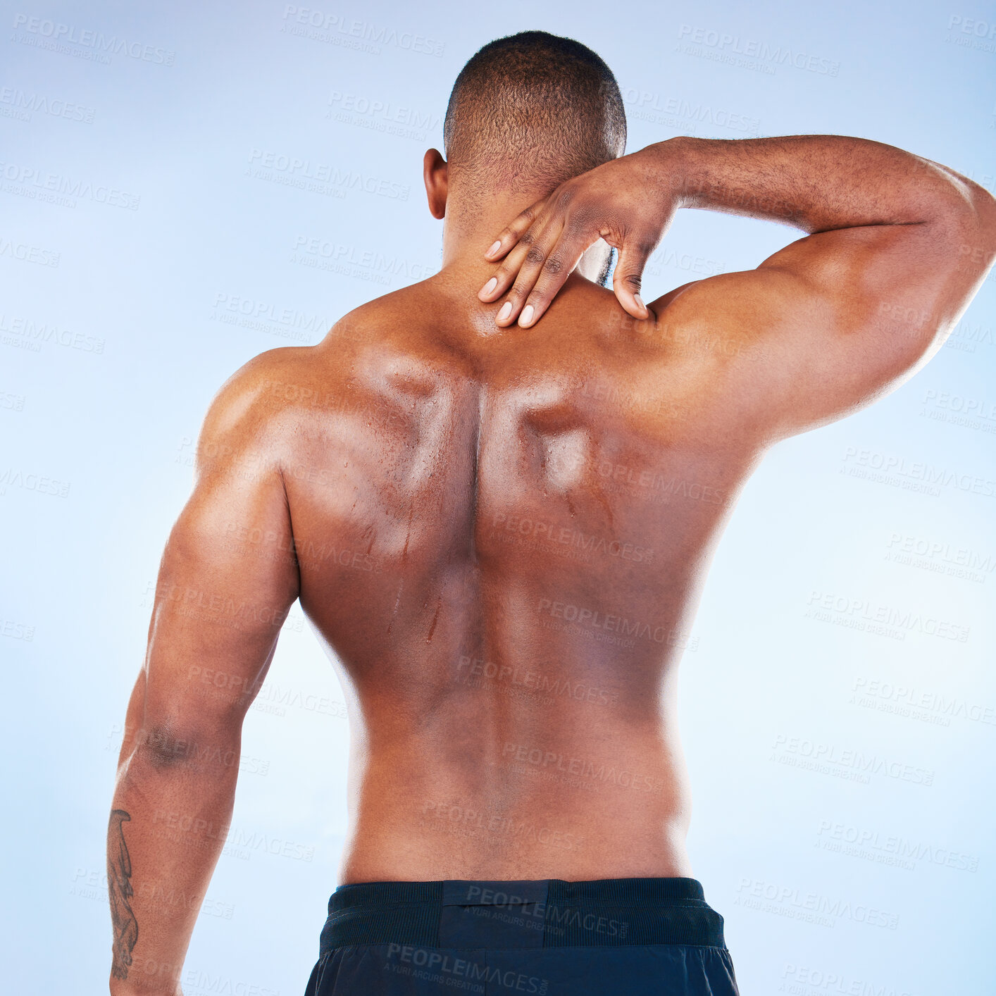 Buy stock photo Black man, neck pain and injury with exercise and health, medical problem and aching body with back view. Emergency, muscle tension and male athlete with joint ache from workout on blue background