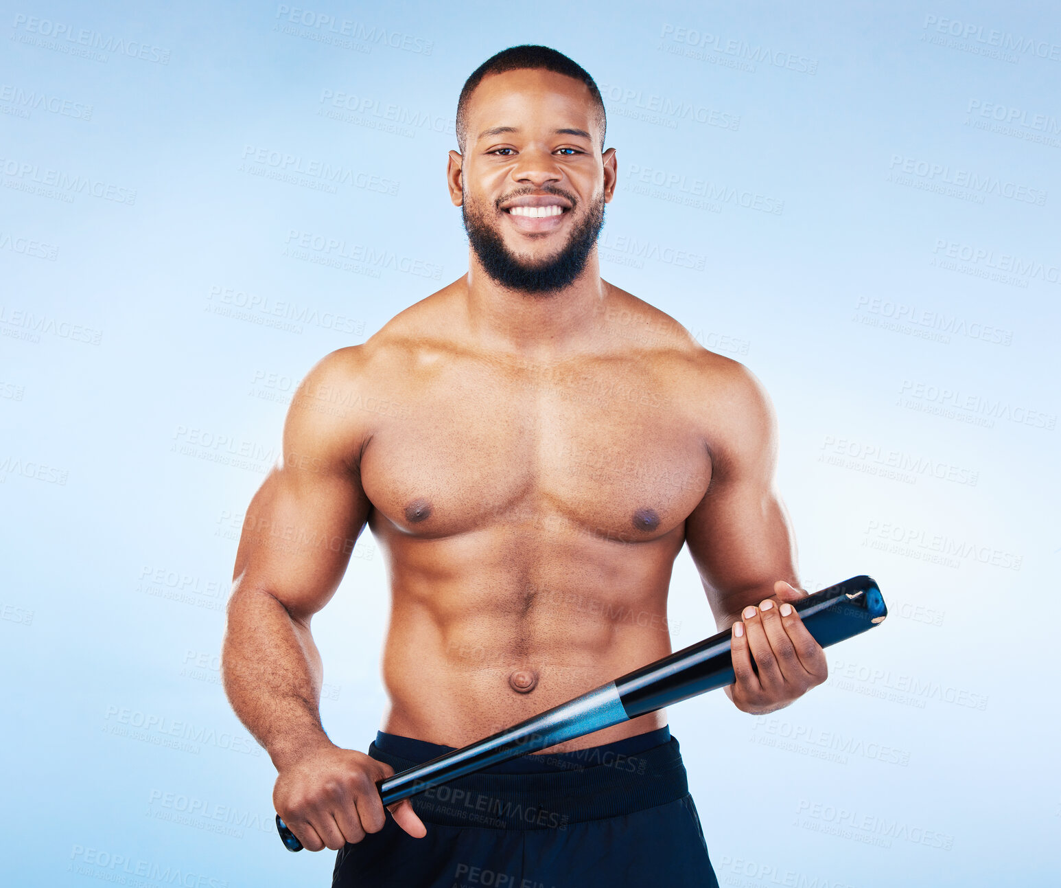 Buy stock photo Black man, portrait and sports body with a baseball bat in studio for health, wellness and fitness. Face of healthy male aesthetic model with sport gear, strong muscle and smile on a blue background