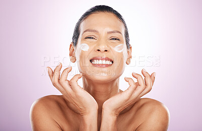 Buy stock photo Face smile, cream and skincare of woman in studio isolated on a purple background. Mature, portrait and happy female model with dermatology lotion, creme and moisturizer cosmetics for healthy skin.