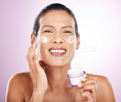 Buy stock photo Face, cream jar and skincare of woman in studio isolated on a purple background. Mature, portrait and happy female model with dermatology lotion, creme and moisturizer cosmetics for healthy skin.