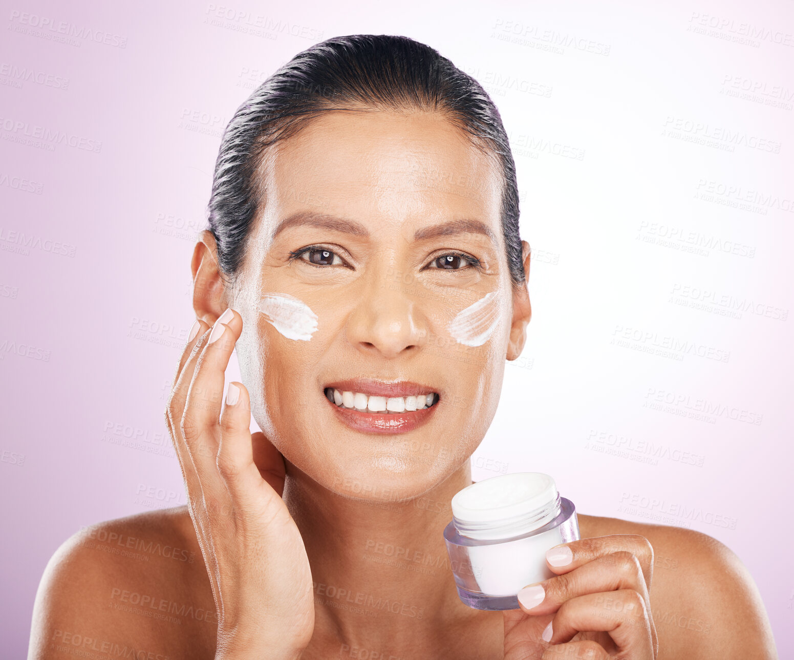 Buy stock photo Face, cream jar and skincare of woman in studio isolated on a purple background. Mature, portrait and happy female apply dermatology lotion, creme product and moisturizer cosmetics for healthy skin.