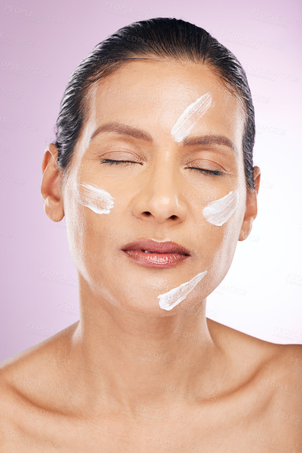 Buy stock photo Face, cream and skincare of woman with eyes closed in studio isolated on a purple background. Mature, cosmetics and female with dermatology lotion, creme or moisturizer for healthy skin or anti aging