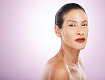 Face, makeup and red lipstick of woman in studio isolated on a purple background mockup. Skincare, cosmetics and portrait, serious and mature female model with lip gloss for skin aesthetic and beauty