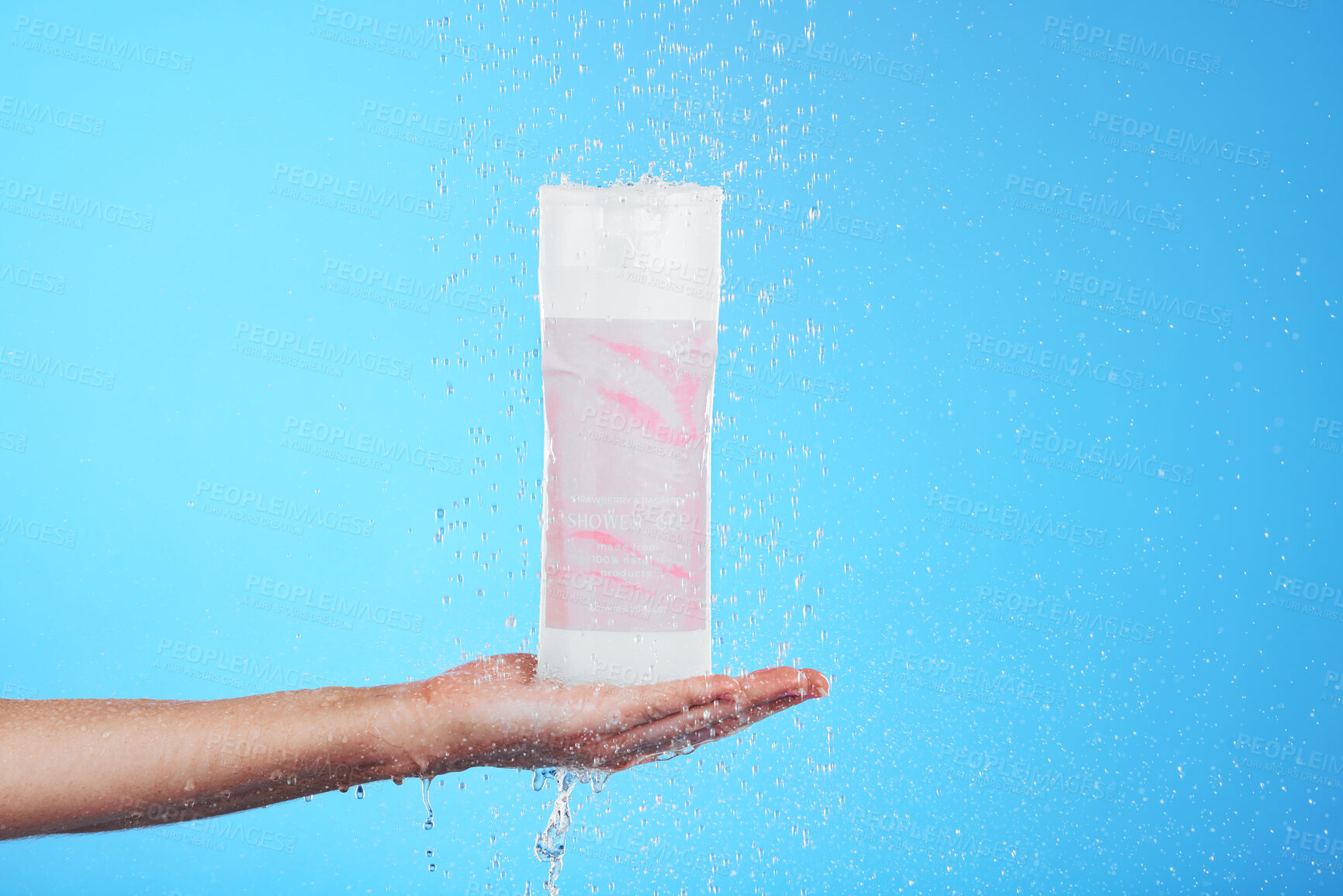 Buy stock photo Shampoo, showing and hand with a bottle in the shower isolated on a blue background in studio. Cleaning, hygiene and person advertising a product for grooming, sanitary care and treatment with mockup