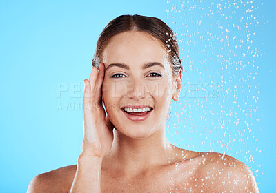 Shower, water and portrait of happy woman in a studio face from cleaning and skincare. Wellness, splash and beauty routine of female model excited from dermatology and self care with blue background