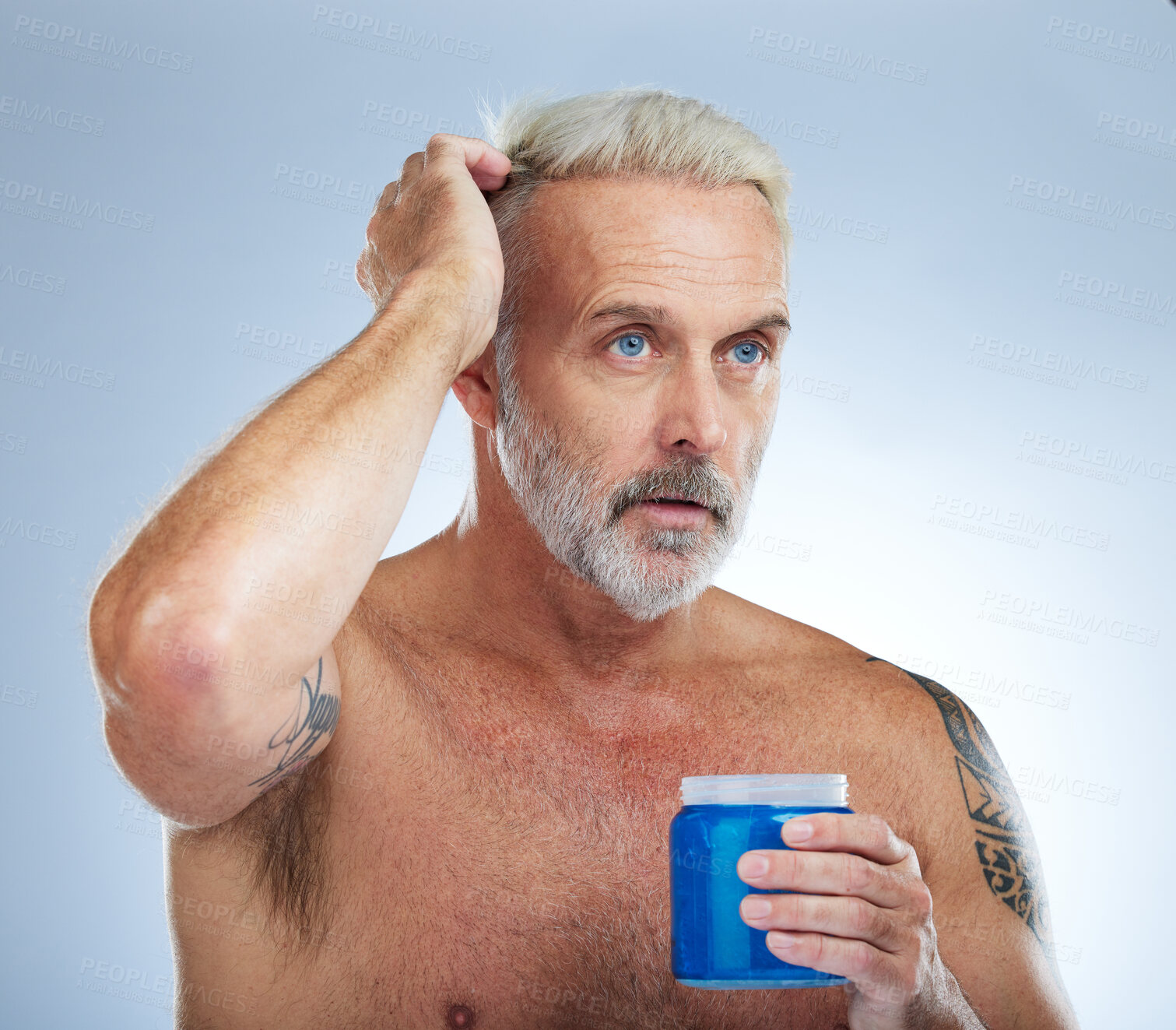 Buy stock photo Hair care, grooming and mature man with gel isolated on a blue background in studio. Beauty, clean and a senior man with a product for styling, hairstyle and applying balm for a hairdo on a backdrop