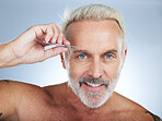 Senior man, tweezers and eyebrow in portrait with smile, beauty and grooming by studio background. Happy elderly model, tweezing and hair removal for cleaning, aesthetic and  cosmetics by backdrop