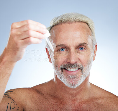 Buy stock photo Old man, portrait and smile, face with oil for skincare, beauty and grooming, facial serum on studio background. Dropper, anti aging cosmetic care with happy senior male and hygiene with dermatology
