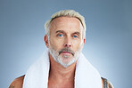 Serious, shower and portrait of man in studio for clean, self care and morning routine. Cosmetics, dermatology and facial with male and towel on grey background for grooming, hygiene or spa treatment