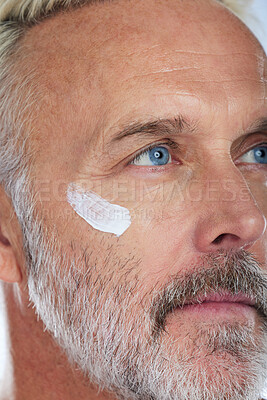 Buy stock photo Skincare, cream and face of senior man in studio for wellness, facial treatment and anti aging cosmetics. Beauty, dermatology and zoom of male model with lotion, creme and moisturizer for hygiene