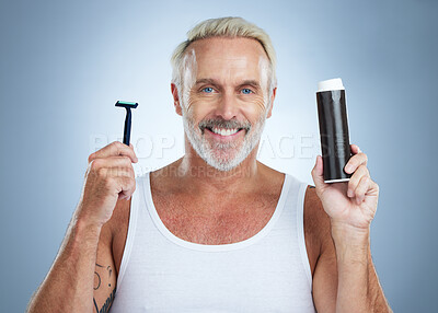 Buy stock photo Senior man, razor and shaving cream for grooming, skincare or hair removal against studio background. Portrait of mature male holding shaver and foam creme for haircare, cosmetics or facial treatment