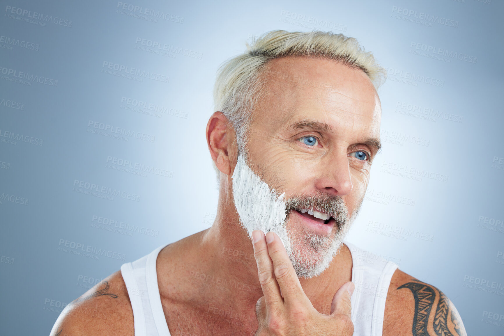 Buy stock photo Senior man, shaving cream and smile for grooming, skincare or hair removal against a studio background. Face of mature male applying shave creme, cosmetics or product for haircare or facial treatment
