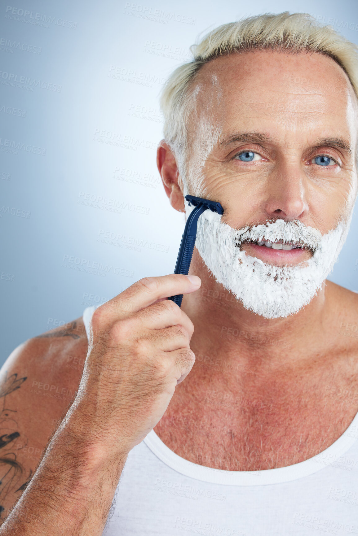 Buy stock photo Man, portrait and razor with shaving cream for grooming beard, skincare or hair removal against studio background. Mature male face with shaver, creme or foam product for hygiene or facial treatment