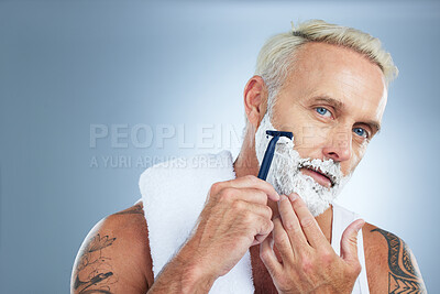 Buy stock photo Senior man, razor and shaving beard with cream for skincare grooming or hair removal against studio background. Portrait of mature male with shaver, creme or foam for clean facial treatment on mockup