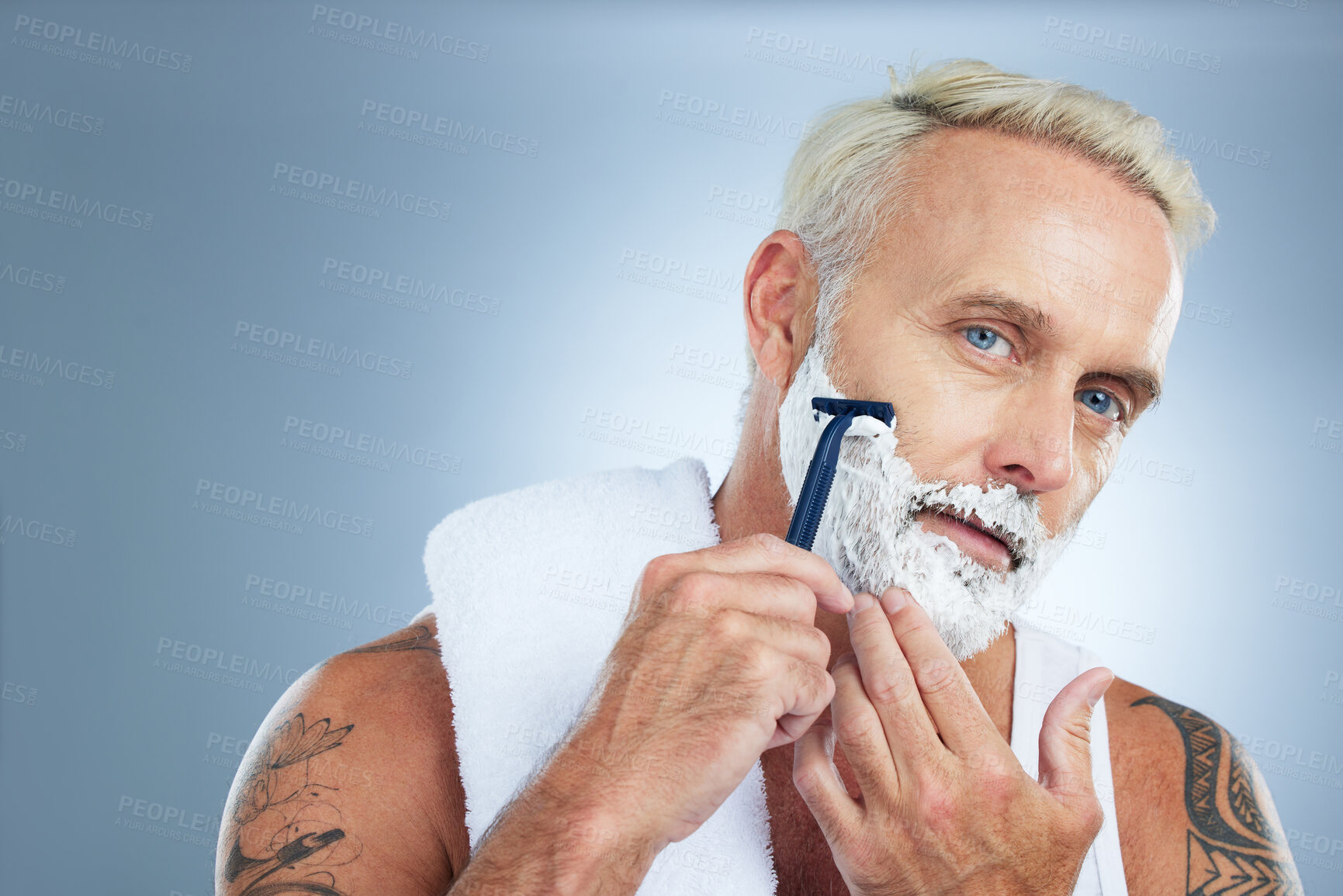 Buy stock photo Senior man, razor and shaving beard with cream for skincare grooming or hair removal against studio background. Portrait of mature male with shaver, creme or foam for clean facial treatment on mockup