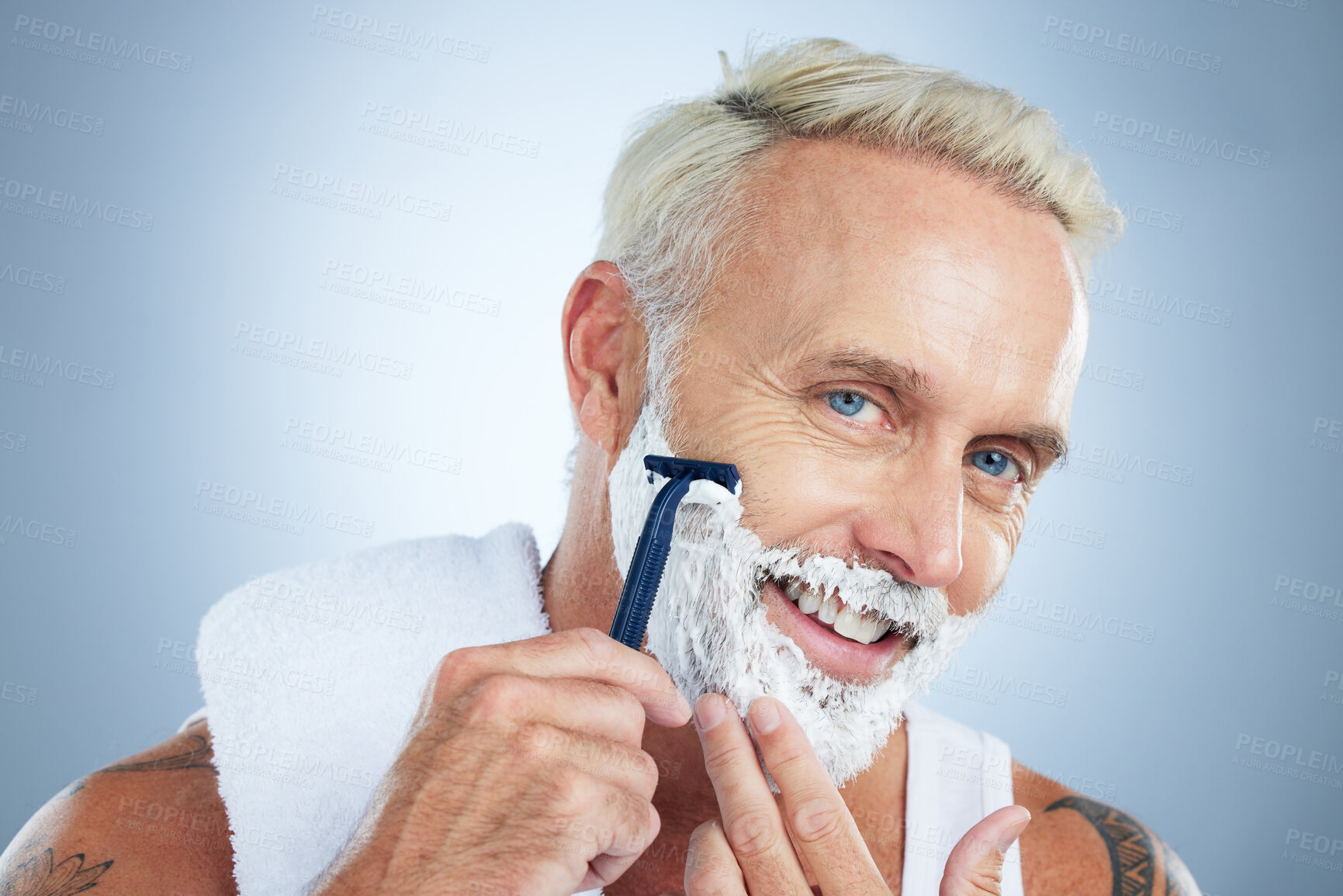 Buy stock photo Senior man, razor and shaving for skincare grooming, beard or hair removal against a studio background. Portrait of happy mature male face with shaver, cream or foam for facial treatment on mockup