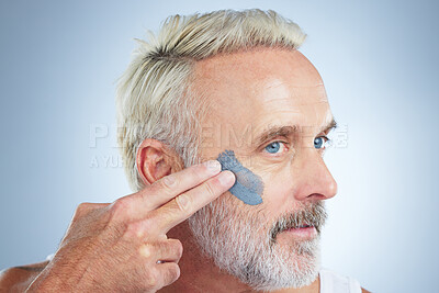 Buy stock photo Beauty, skincare and facial with man in studio for cleansing, detox and spa treatment. Cosmetics, mud mask and dermatology with senior model on gray background for anti aging, product and natural