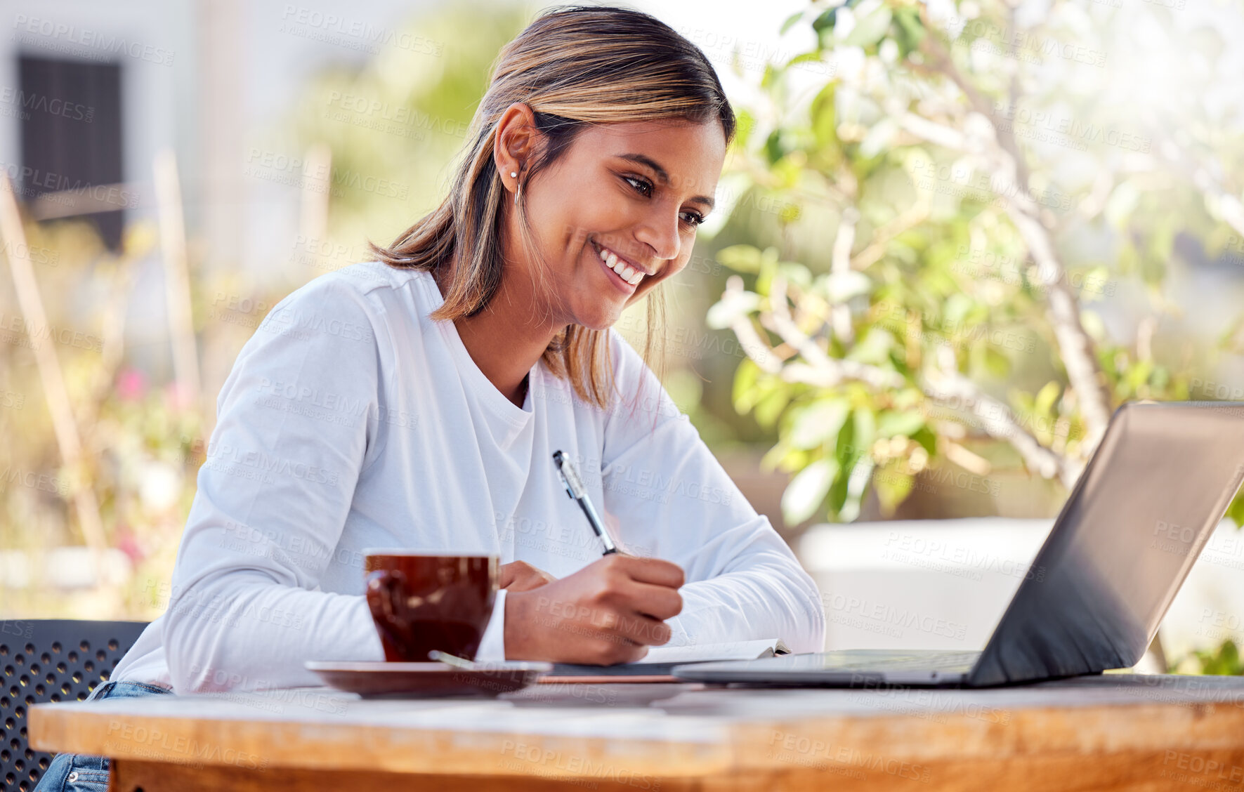 Buy stock photo Woman writing notes, student and laptop, learning with smile and study academic course, education and university. Female at outdoor cafe, freelancer and research for project, happy with productivity