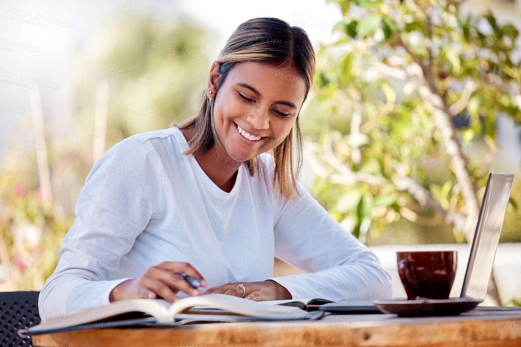 Buy stock photo Woman writing notes, student and education with smile, study and academic course, learning and university. Female at outdoor cafe, notebook and pen with scholarship and research for school project 
