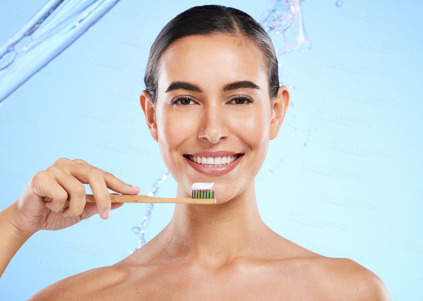 Buy stock photo Portrait, water or happy woman brushing teeth smiling with product for healthy oral or dental hygiene in studio. Face, smile beauty or girl model cleaning mouth with natural bamboo wooden toothbrush