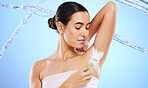 Beauty, water splash and woman with razor for shaving armpit with foam, cleaning products and cosmetics in studio. Skincare, hair removal and girl with shaver for body hygiene, grooming and wellness