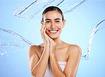 Happy woman, water splash and portrait smile for skincare moisturizer, product or cream against a blue studio background. Calm female face in natural beauty cosmetics, hygiene or facial treatment