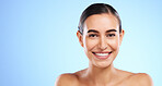 Smile, skincare portrait or happy woman in studio with youth, beauty or young face on blue background. Dermatology cosmetics, wellness or beautiful girl with facial treatments or glowing results 