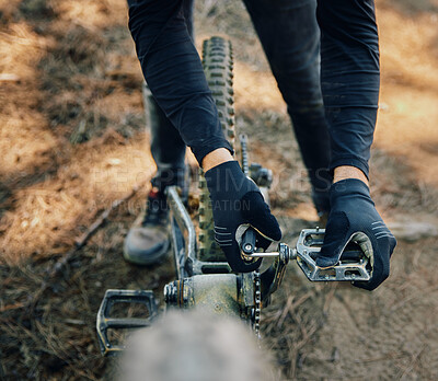 Buy stock photo Hands, bicycle and repair pedal in woods for speed, dirt and nature in summer for extreme sport athlete. Man, Mountain bike expert and outdoor for workout, training and exercise in forest