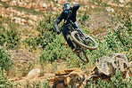 Action, sports and mountain bike with man jumping in nature for cycling, fitness and adventure. Adrenaline junkie,  performance and stunt with athlete riding in outdoors for action, risk and training