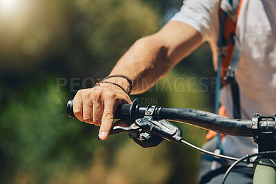 Buy stock photo Mountain bike, cyclist hand and brake outdoor in nature in sunshine for safety, extreme sport or lens flare. Man, bicycle and marathon challenge for fast workout, training or exercise for summer race