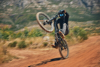 Buy stock photo Cycling, training and person on a bicycle in the countryside for extreme sport, adrenaline and fun. Speed, action and cyclist on a dirt road for stunt, trick or fitness, freedom and balance in nature