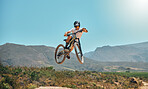 Mountain bike, cycle and air with a sports man jumping outdoor while riding on a track for adrenaline.  Fitness, sky and risk with a male athlete taking a ride on his bicycle for freedom or adventure