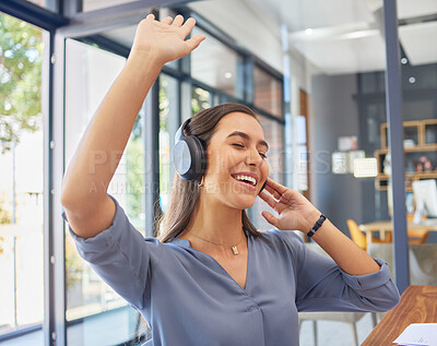 Headphones, music and happy business woman dance in office, smile and excited while having fun. Podcast, radio and dancing female corporate employee relax with audio playlist, track or song at work