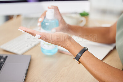 Buy stock photo Hands, covid or sanitizer and a business woman cleaning for hygiene or compliance with regulations in the office. Safety, desk or bacteria and a female employee spraying her hand with disinfectant