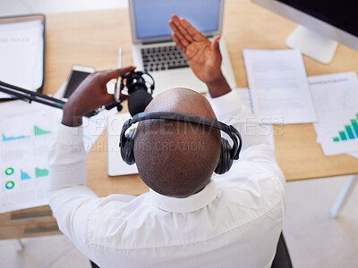 Buy stock photo Laptop, headphones and black man with microphone for podcast, video call or live streaming in office. Business, marketing and top view of male entrepreneur with mic for content creation or radio host