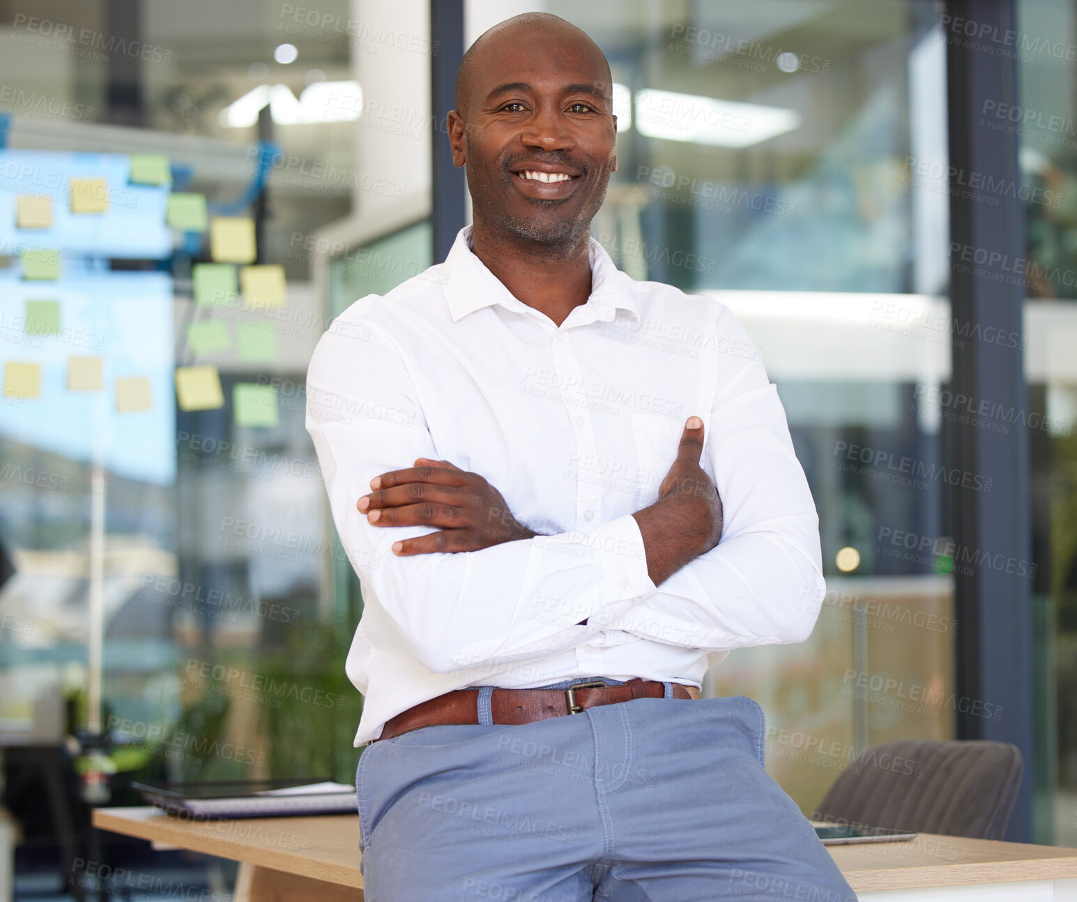 Buy stock photo Portrait, business smile and black man with arms crossed in office with pride for career, job or occupation. Ceo, boss and happy, proud and confident male entrepreneur from Kenya with success mindset