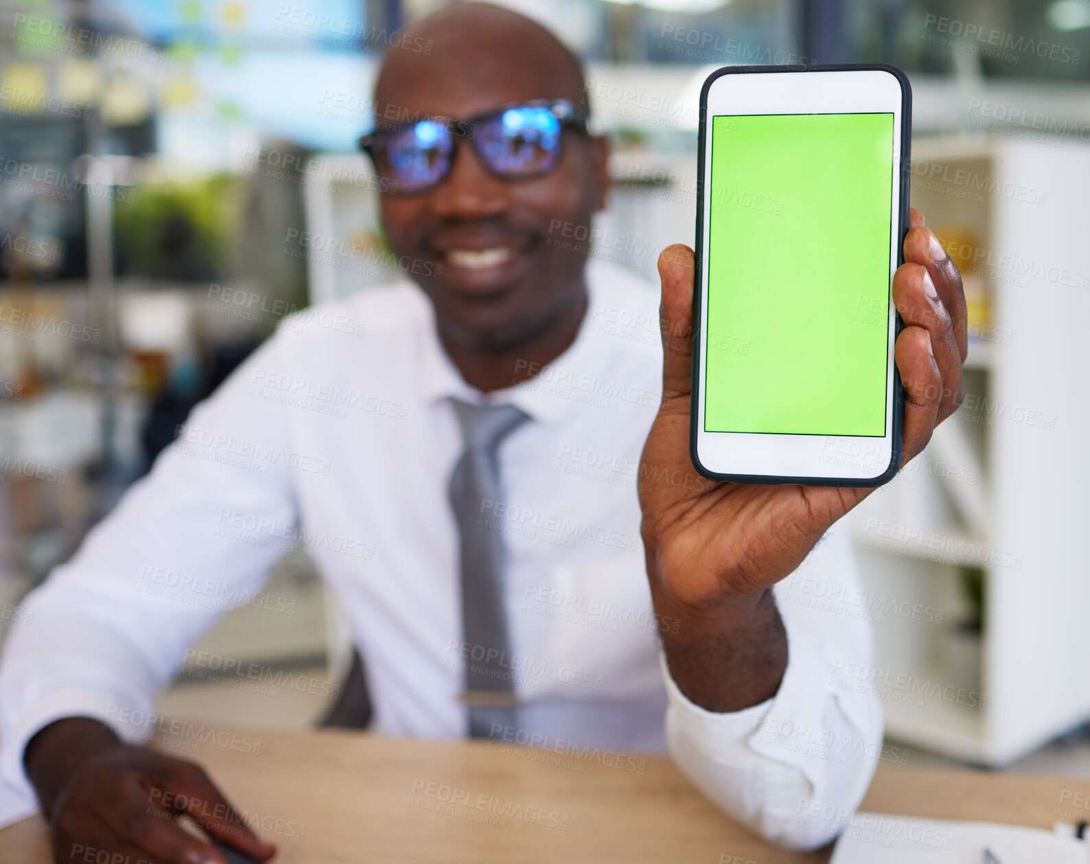 Buy stock photo Phone, hands and black man with green screen for mock up, advertising or marketing in office. Mockup, business and African male entrepreneur with smartphone for branding space or product placement.