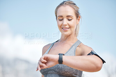 Buy stock photo Fitness, woman and smart watch checking time, tracking performance or monitoring exercise in nature. Happy and fit female runner looking at wristwatch for sport tracker, counter or workout on mockup