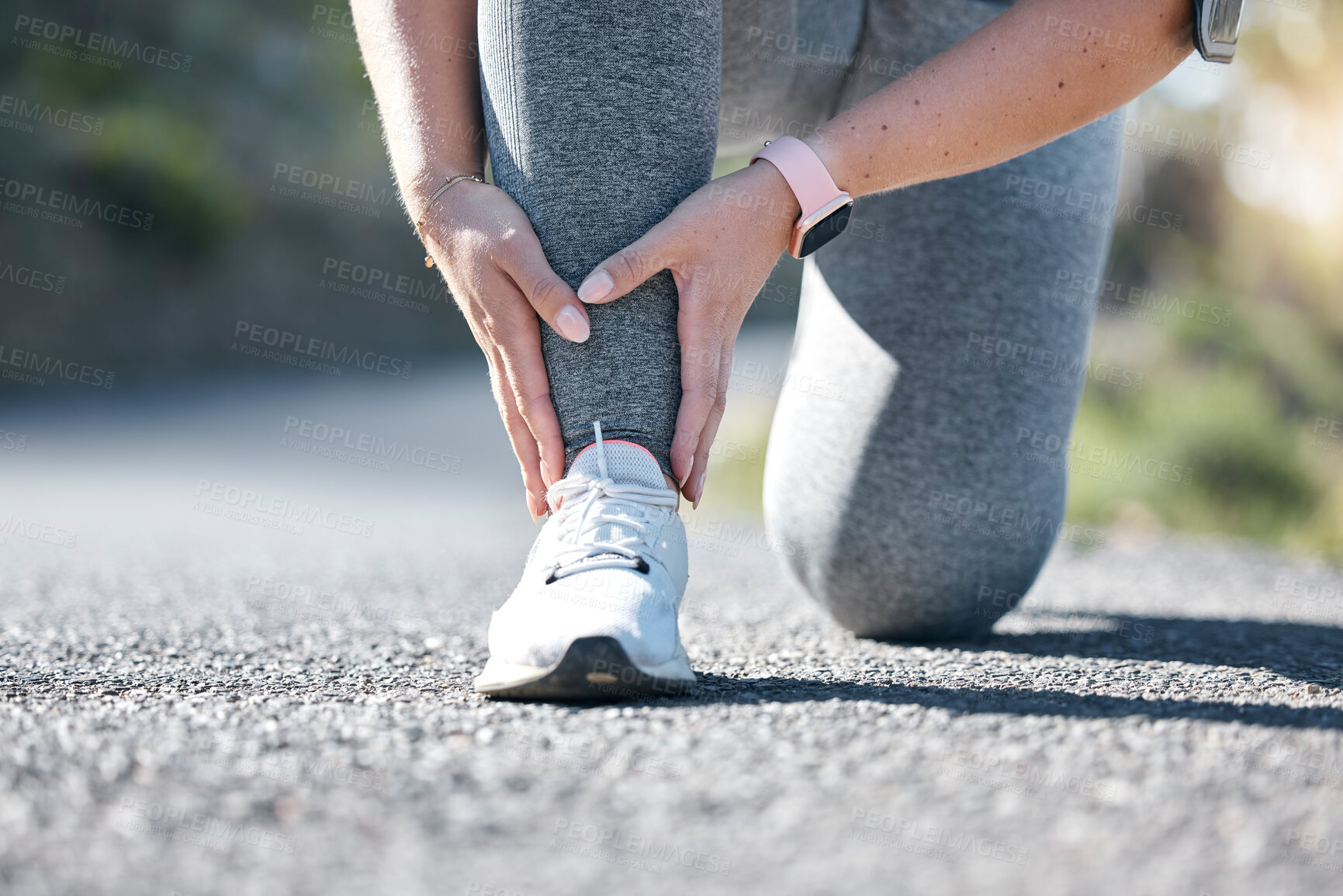 Buy stock photo Running, fitness and ankle injury with a woman on the street during a cardio or endurance workout. Medical, pain and accident with a female runner outdoor on a road for health, sports or training