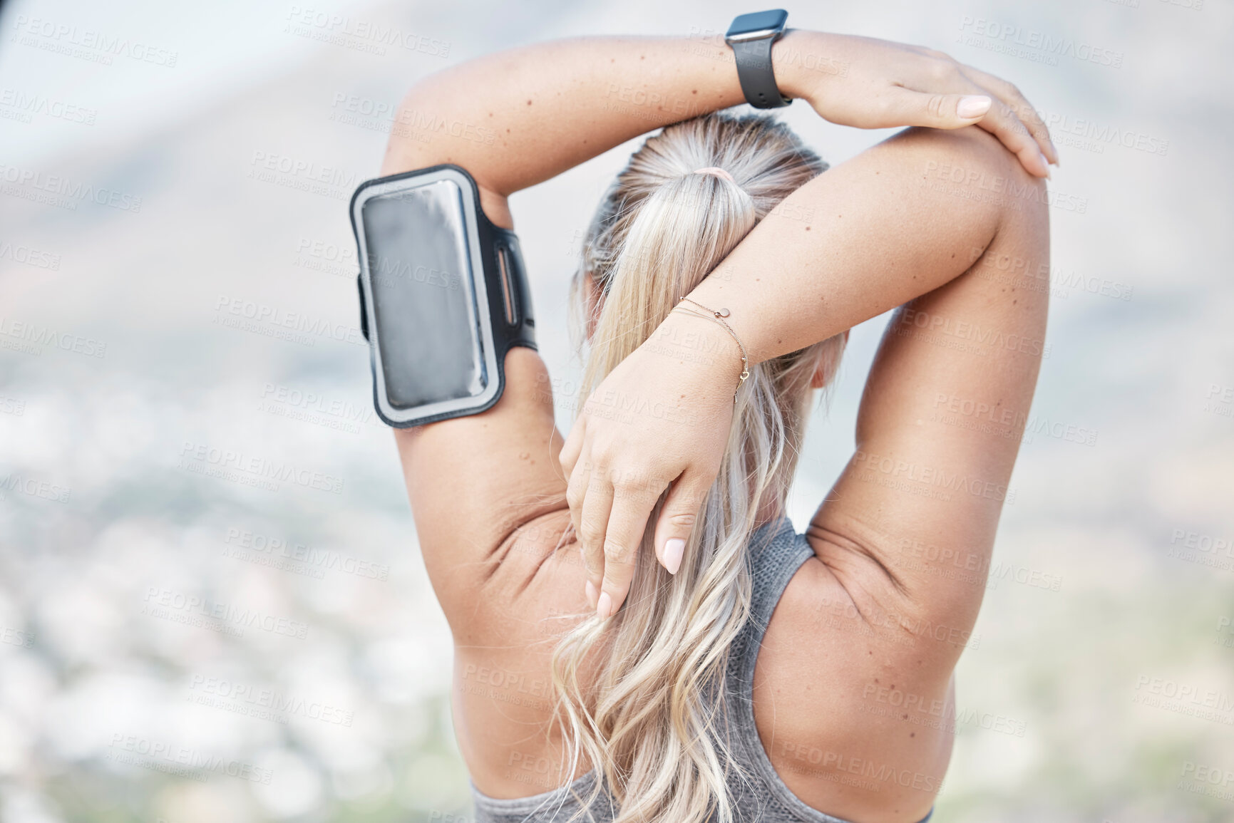 Buy stock photo Fitness, woman and back stretching arms for exercise, running or start workout in nature. Rear view of fit female runner in warm up arm stretch for training preparation or healthy wellness outdoors